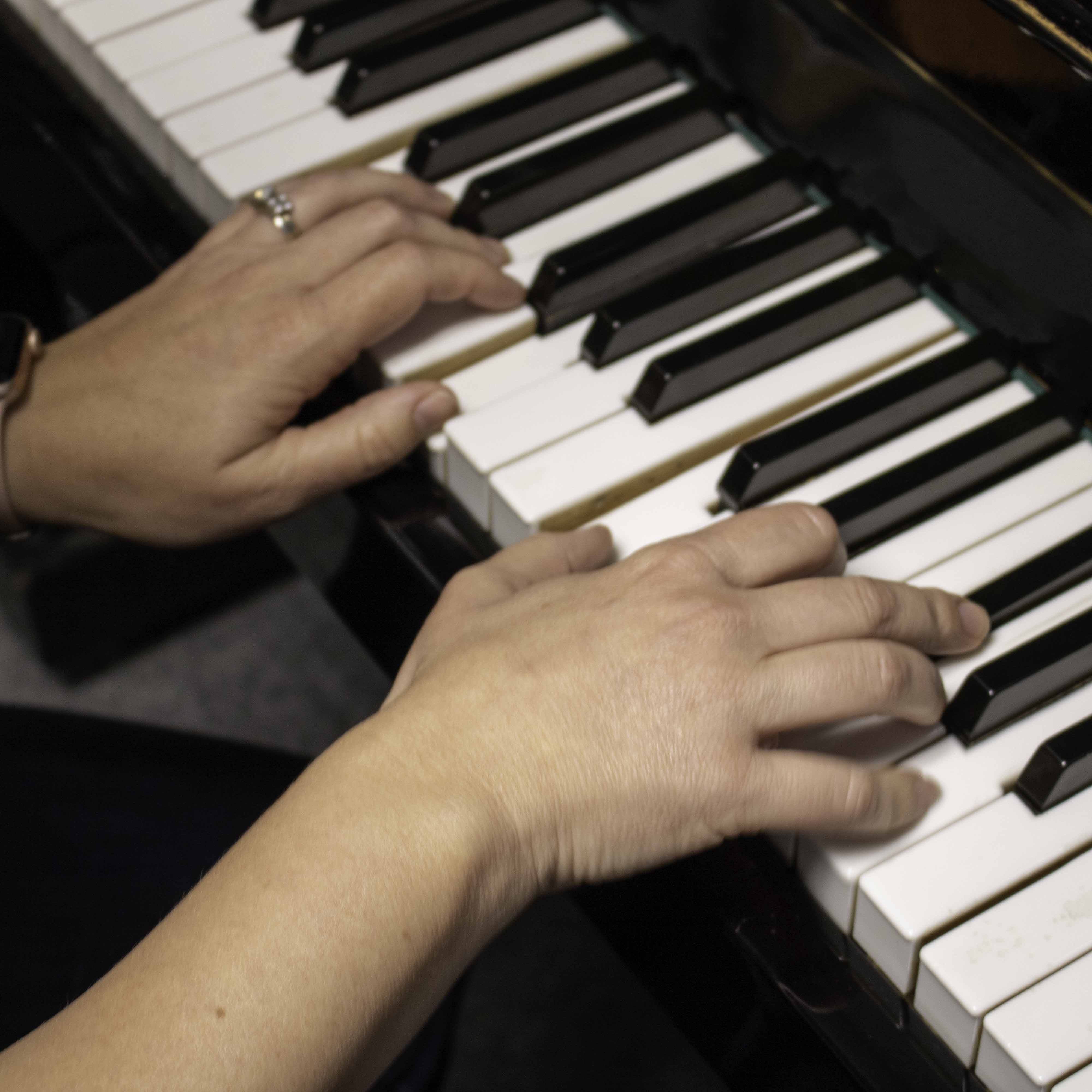 Person Playing Piano